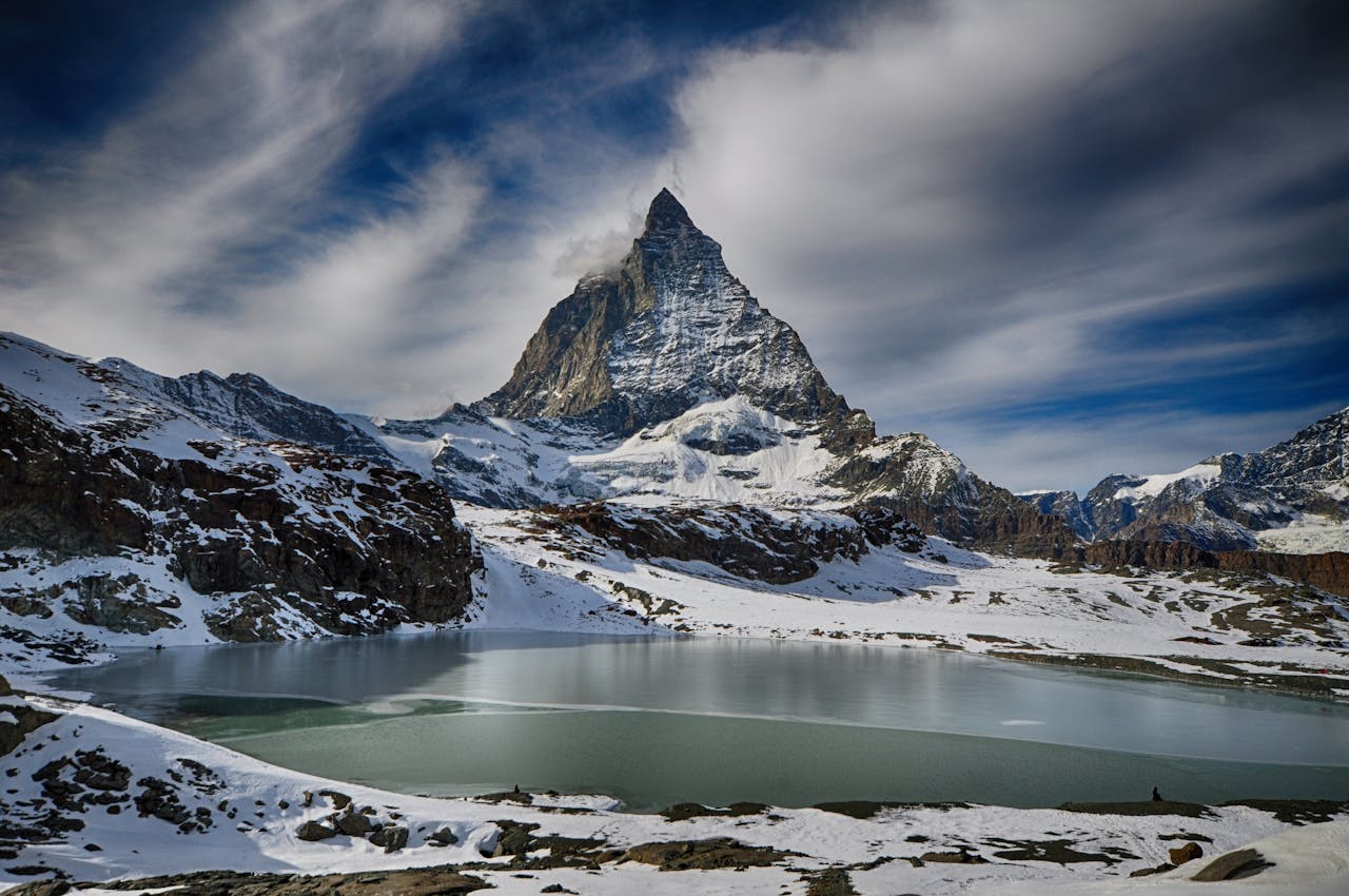 Services Scenic winter view of the Matterhorn mountain with a lake, perfect for adventure and travel imagery.